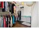 Organized walk-in closet with ample storage and shelving at 58 Aster St, Clearwater Beach, FL 33767
