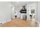Hallway featuring hardwood floors and doorways leading to multiple rooms at 5816 S 3Rd St, Tampa, FL 33611