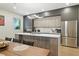 Modern kitchen with stainless steel appliances, white countertops, and a spacious island with seating at 5816 S 3Rd St, Tampa, FL 33611