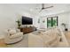 Spacious living room featuring a comfortable sectional sofa, modern furnishings, and ample natural light at 5816 S 3Rd St, Tampa, FL 33611