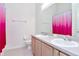Bright bathroom with double sink vanity, toilet, and shower tub combination at 6231 Olivedale Dr, Riverview, FL 33578