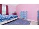 Bedroom with a queen sized bed, accent rug, and a large cabinet at 6231 Olivedale Dr, Riverview, FL 33578