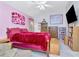 Bright bedroom with unique wall decorations, dark furnishings and ample sunlight at 6231 Olivedale Dr, Riverview, FL 33578