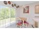 Cozy breakfast nook with table and chairs, filled with natural light from sliding glass doors at 6231 Olivedale Dr, Riverview, FL 33578