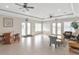 Community clubhouse featuring a large open seating area with ceiling fans, tables, and chairs at 6231 Olivedale Dr, Riverview, FL 33578