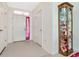 Bright entryway with tile flooring, a coat closet and a decorative display cabinet at 6231 Olivedale Dr, Riverview, FL 33578