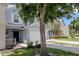 Charming townhome featuring light blue exterior paint and a one-car garage at 6231 Olivedale Dr, Riverview, FL 33578