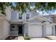 Charming townhome featuring light blue exterior paint, white trim, and a one-car garage at 6231 Olivedale Dr, Riverview, FL 33578