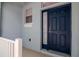 Close up of a stylish blue front door with sidelight, offering a welcoming entrance at 6231 Olivedale Dr, Riverview, FL 33578