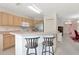Eat-in kitchen area featuring breakfast bar with seating overlooking the front entry at 6231 Olivedale Dr, Riverview, FL 33578