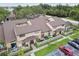 Aerial view of the condo community showcases lush landscaping and parking areas at 6262 142Nd N Ave # 1302, Clearwater, FL 33760