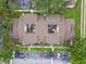 This aerial view shows well-maintained building exteriors with patios, landscaping, and designated parking areas at 6262 142Nd N Ave # 1302, Clearwater, FL 33760