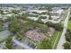 A tranquil aerial of a residential community including tennis court and pool at 6262 142Nd N Ave # 1302, Clearwater, FL 33760