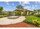 Exterior view of the clubhouse with elegant arched entrances and surrounding landscaping at 6262 142Nd N Ave # 1302, Clearwater, FL 33760