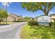 Via Verde deed restricted community sign with tree lined street at 6262 142Nd N Ave # 1302, Clearwater, FL 33760