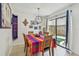 The dining room features tile floors and a sliding glass door to the outside patio at 6262 142Nd N Ave # 1302, Clearwater, FL 33760