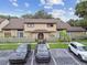 Exterior view of the condo with designated parking spaces and a well-kept lawn at 6262 142Nd N Ave # 1302, Clearwater, FL 33760