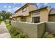Exterior view of the condo featuring well-kept landscaping and a stucco facade at 6262 142Nd N Ave # 1302, Clearwater, FL 33760