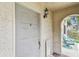 Unit front door and patio area with outdoor seating for relaxing and enjoying the view at 6262 142Nd N Ave # 1302, Clearwater, FL 33760