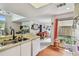 Bright kitchen with breakfast bar open to the dining and living areas at 6262 142Nd N Ave # 1302, Clearwater, FL 33760