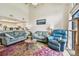 Bright living room boasts a colorful rug, comfortable seating, and an open layout with a view to the kitchen at 6262 142Nd N Ave # 1302, Clearwater, FL 33760