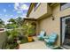 Inviting patio with chairs, table, and potted plants, creating a cozy outdoor living space at 6262 142Nd N Ave # 1302, Clearwater, FL 33760