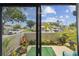 Enclosed patio with lush potted plants and outdoor seating, offering a private outdoor space at 6262 142Nd N Ave # 1302, Clearwater, FL 33760