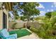 Charming patio with lush plants, outdoor seating, and privacy wall, ideal for relaxation at 6262 142Nd N Ave # 1302, Clearwater, FL 33760