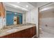 Bathroom featuring double sinks with granite countertops and a full tub and shower combination at 6706 Dunes Ln, Temple Terrace, FL 33617