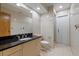 Bathroom featuring tiled walls, a walk-in shower, and vanity at 6706 Dunes Ln, Temple Terrace, FL 33617