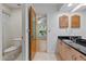 Tiled bathroom with tub-shower combo and vanity with storage at 6706 Dunes Ln, Temple Terrace, FL 33617