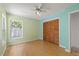 Cozy bedroom with wood floors, window, and a spacious closet at 6706 Dunes Ln, Temple Terrace, FL 33617