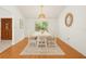 Dining room features natural light, wood floors, and stylish accents at 6706 Dunes Ln, Temple Terrace, FL 33617
