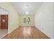 Bright dining area with hardwood floors and a decorative chandelier at 6706 Dunes Ln, Temple Terrace, FL 33617