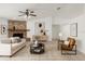 Cozy living room showcasing a brick fireplace, modern furnishings, and neutral color palette at 6706 Dunes Ln, Temple Terrace, FL 33617