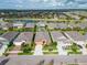 An aerial shot of a home with a pool, surrounded by well-maintained lawns and neighborhood streets at 7408 Sungold Meadow Ct, Apollo Beach, FL 33572