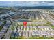 Expansive aerial view of a community with homes and many Personal-made lakes, with a marked location pin at 7408 Sungold Meadow Ct, Apollo Beach, FL 33572