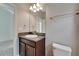 This stylish bathroom boasts a granite countertop, ample lighting, and modern fixtures at 7408 Sungold Meadow Ct, Apollo Beach, FL 33572