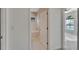 The bathroom features a shower and tub with a window for natural light and tile flooring for easy maintenance at 7408 Sungold Meadow Ct, Apollo Beach, FL 33572