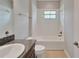 Bright bathroom showcasing granite countertops and a well-maintained tub and shower combination at 7408 Sungold Meadow Ct, Apollo Beach, FL 33572