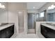 Bathroom featuring double vanity, glass-enclosed shower, and tile flooring at 7408 Sungold Meadow Ct, Apollo Beach, FL 33572