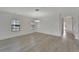 Dining room with decorative wall paneling, chandelier lighting, and wide windows, creating a sophisticated dining space at 7408 Sungold Meadow Ct, Apollo Beach, FL 33572