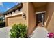 Welcoming home exterior showcasing a two-car garage, well-kept lawn and covered front porch at 7408 Sungold Meadow Ct, Apollo Beach, FL 33572