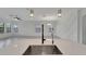 Spacious kitchen island with a stainless steel sink and open-concept to the living room at 7408 Sungold Meadow Ct, Apollo Beach, FL 33572