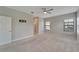 Spacious main bedroom with carpet flooring, ceiling fan, and lots of natural light at 7408 Sungold Meadow Ct, Apollo Beach, FL 33572