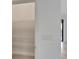 Walk-in pantry with shelving, offering ample storage space, next to light switches and a view to the next room at 7408 Sungold Meadow Ct, Apollo Beach, FL 33572