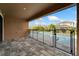 The covered patio overlooks a fenced pool and lush backyard at 7408 Sungold Meadow Ct, Apollo Beach, FL 33572