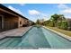 A long, inviting pool and backyard for entertainment and enjoyment at 7408 Sungold Meadow Ct, Apollo Beach, FL 33572