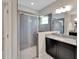 Shower featuring sleek tiling, glass door, and modern fixtures at 7408 Sungold Meadow Ct, Apollo Beach, FL 33572