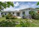 Exterior view of backyard with patio, flowers and landscaped area at 760 72Nd N Ave, St Petersburg, FL 33702